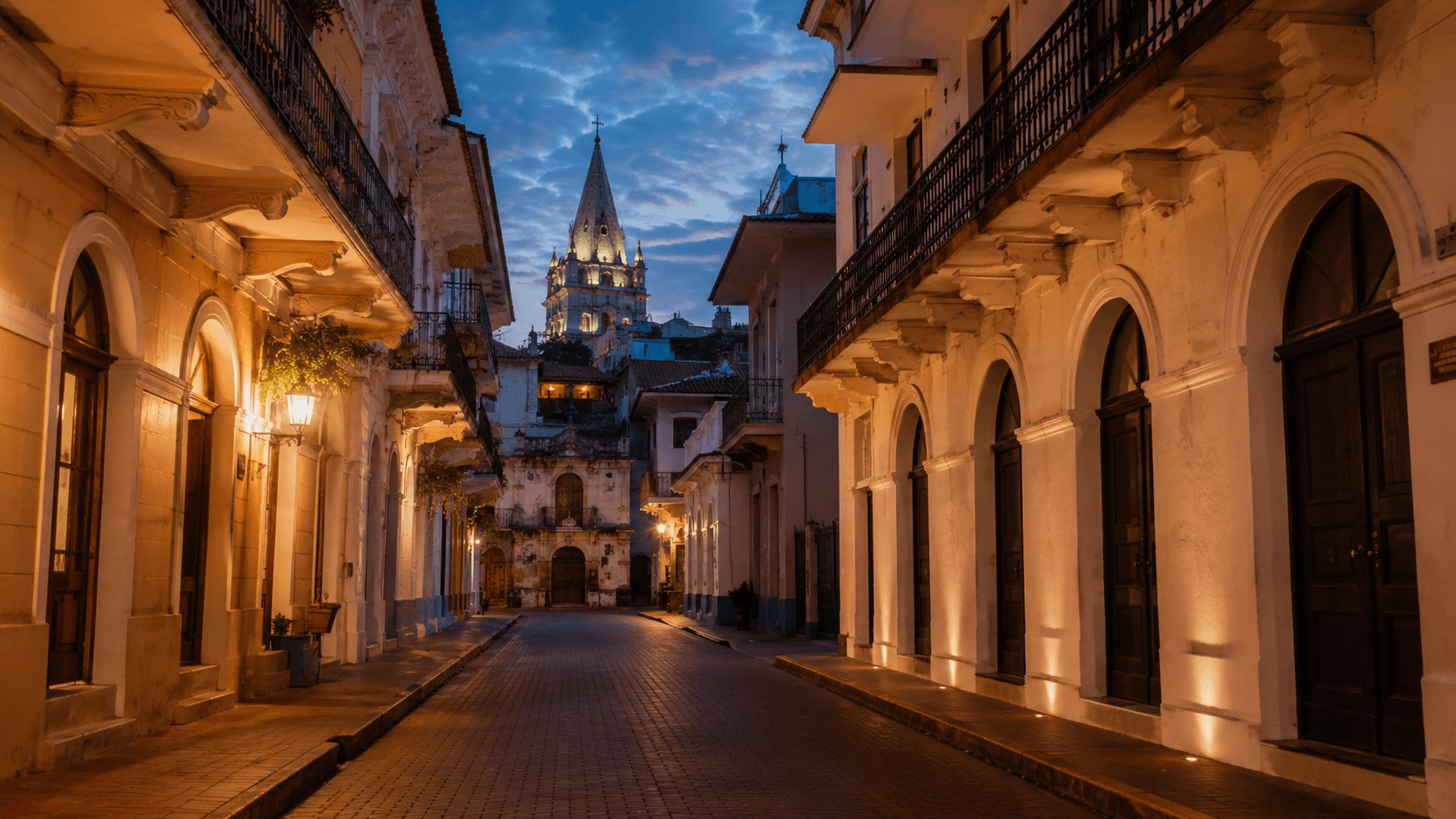 Casco Viejo, Panama City at evening — colonial-era buildings with restored facades along narrow cobbled streets, the cathedral spire visible against a darkening sky. The image represents the active Central America retirement-visa alternatives — Panama Pensionado, Costa Rica Pensionado, Colombia Visa M, Ecuador Jubilado, Dominican Republic Pensionado — that remain available after Nicaragua's Pensionado regime was repealed in 2024.
